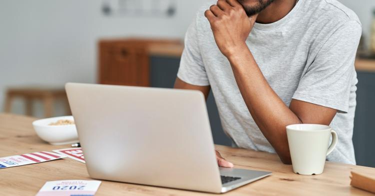 Person registering to vote for 2020 election on laptop 
