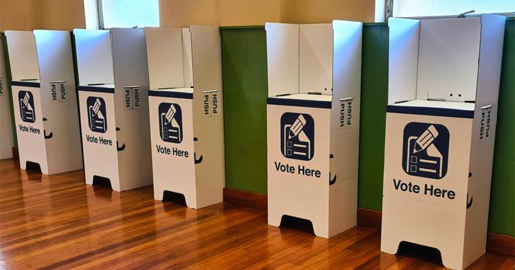 Empty white voting booths