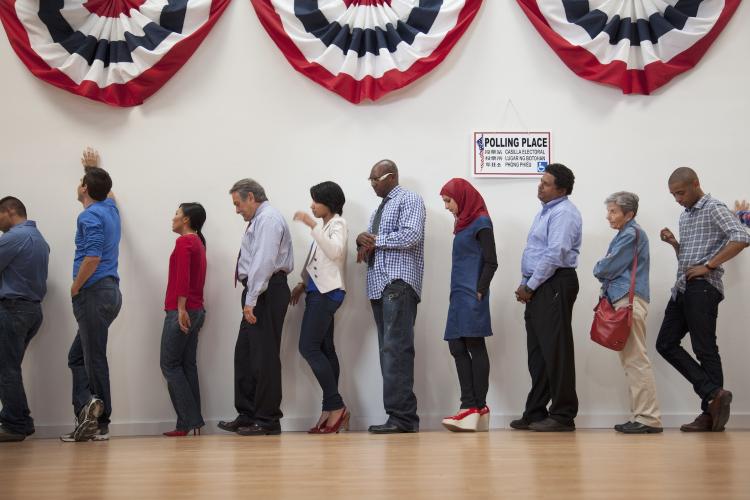 Line of voters dress in red, white and blue