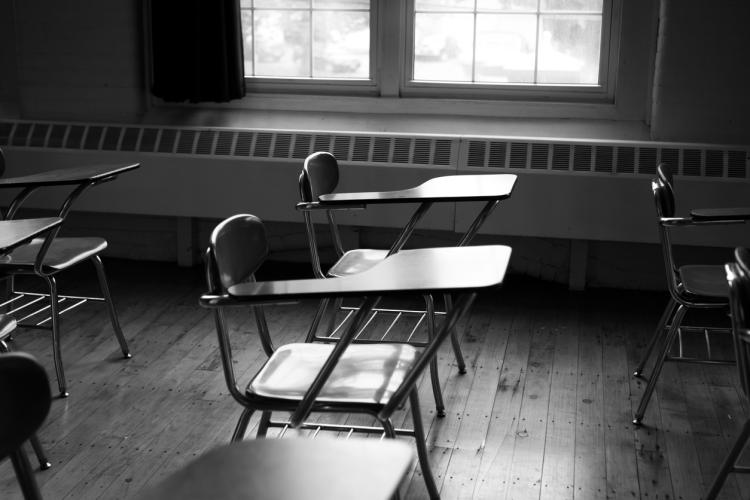 Black and white photo of classroom desks 