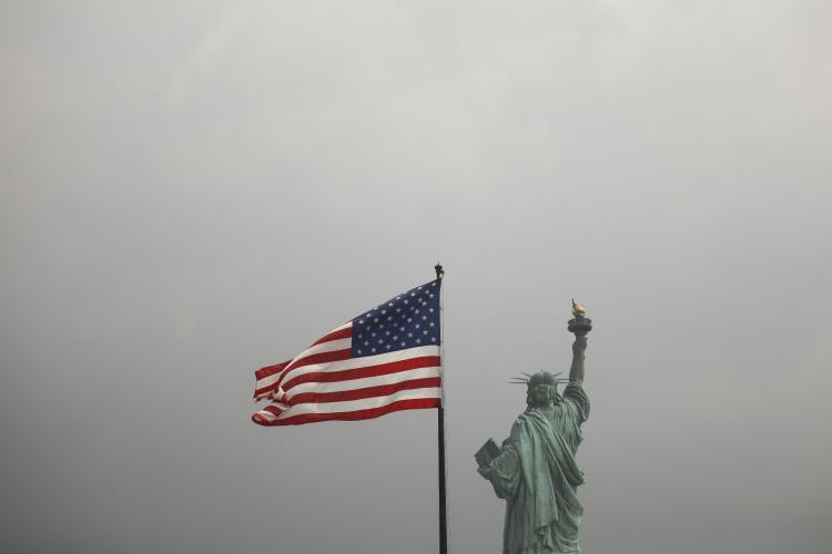 American flag with statue of liberty