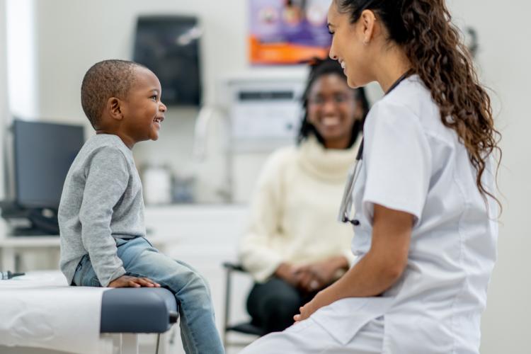 Child at wellness visit with pediatrician