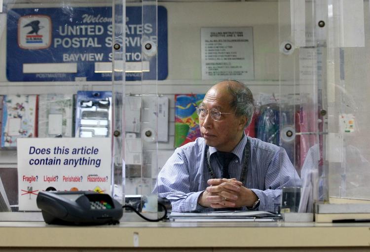 U.S. Postal Service work at U.S. Post Office booth 