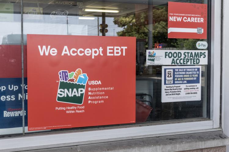 SNAP poster at a supermarket window