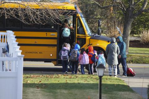 Children on line for a school bus 