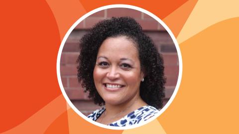 Headshot of Andrea Benjamin in a circle against SSN's orange texture file