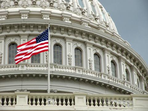 Capitol building with U.S. flag in Washington D.C.