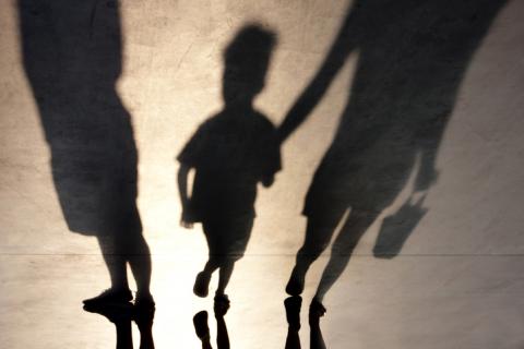 Shadows of family with child and two adults