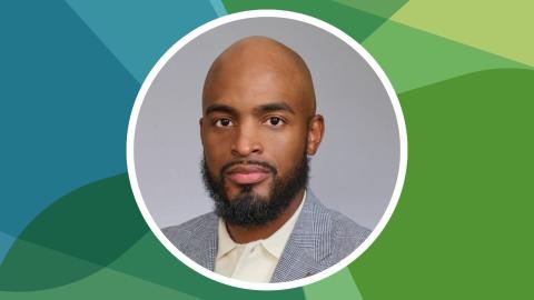 Headshot of Jerry Whitmore Jr. against SSN's blue-green texture file