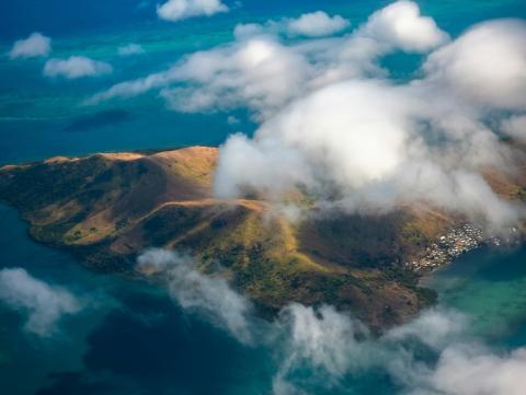 The island of Fiji, view from above, with clouds in view 