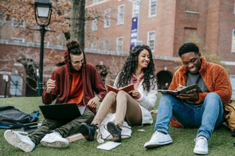Group of college students doing homework