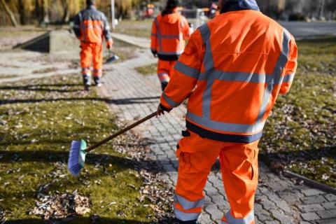 Beginning of work day for workers dressed in bright orange gear