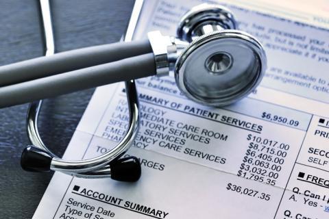 Health care bill with stethoscope on top 
