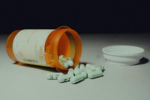 pill bottle with pills falling out