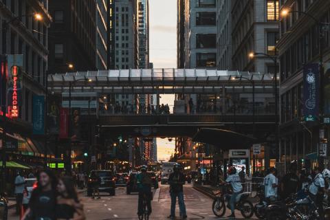 People in the streets of Downtown Chicago during dusk 