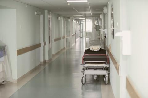 empty hospital  corridor with hospital bed trolly in hallway