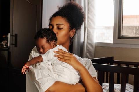 Mother holding infant 