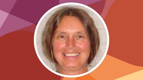 Headshot of Sharon Tisher against SSN's red-purple texture file