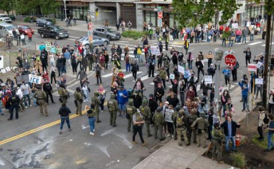 Protesters amass on the street to protest against ICE presence in Portland, Oregon